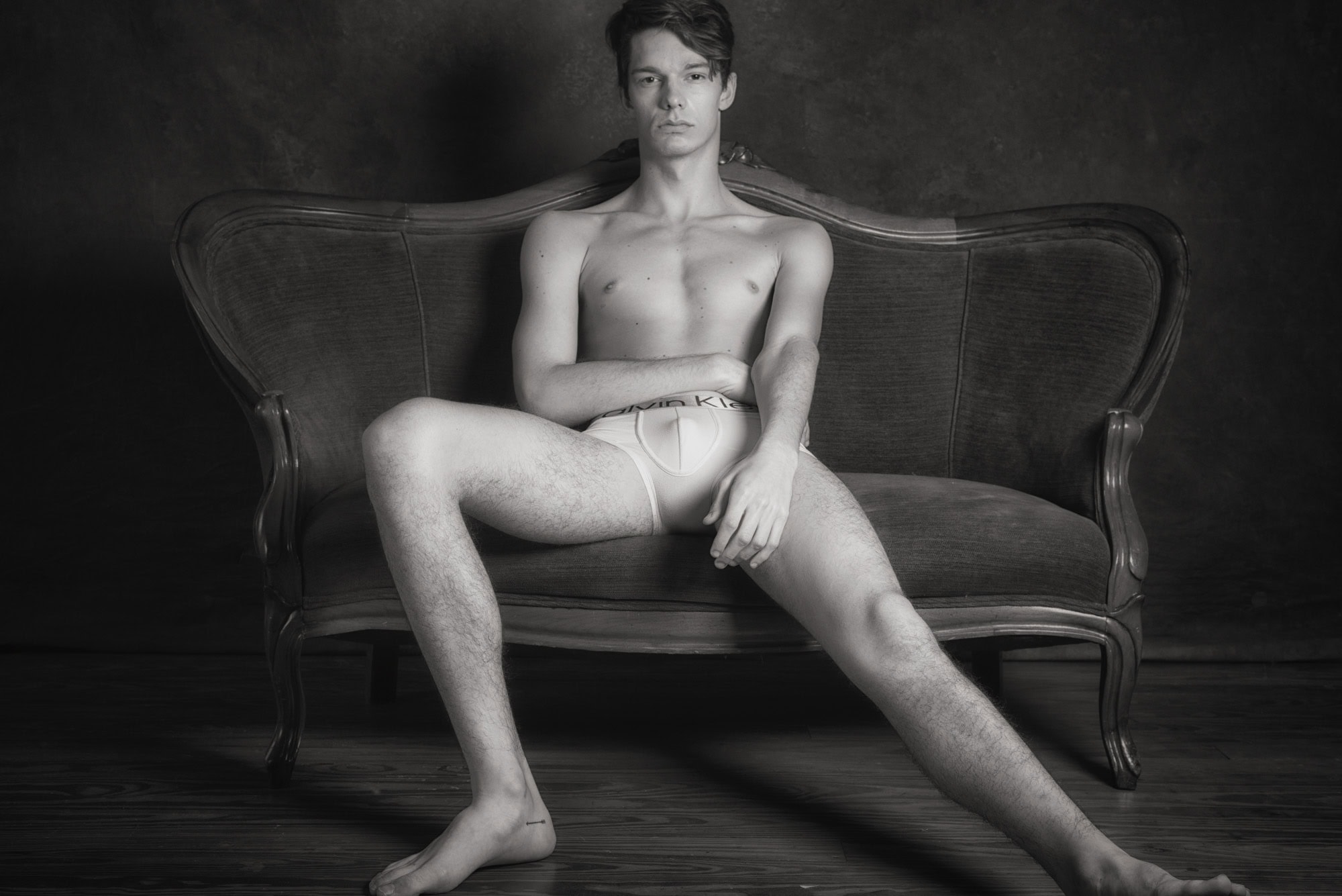 Fine art male boudoir portrait Houston — black and white settee session by Trey Fox Photography
