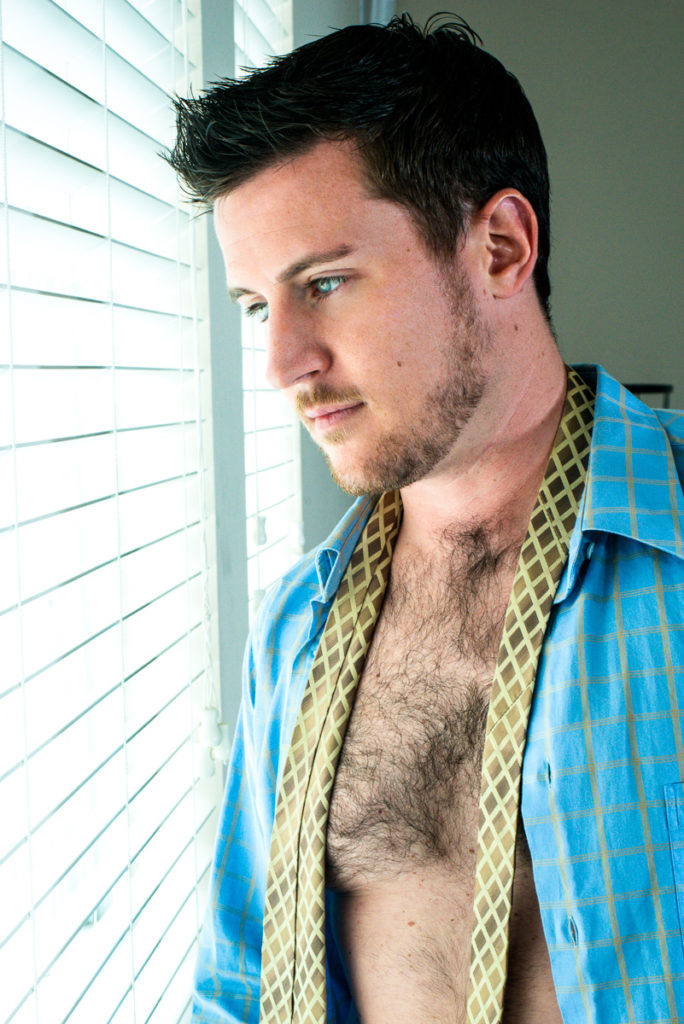Guy in window: male boudoir photography by Trey Fox | Houston